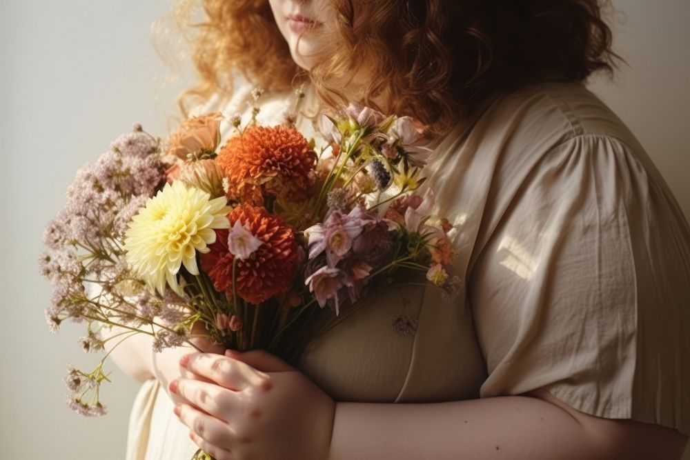 Chubby body woman holding flowers adult plant celebration.