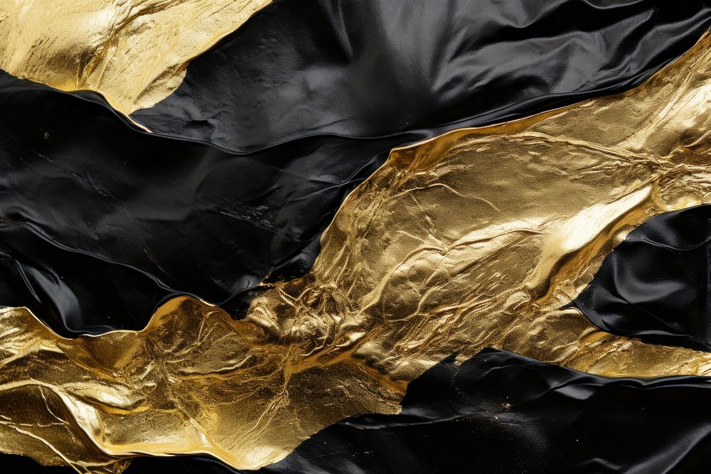 Gold and black backgrounds crumpled wrinkled.