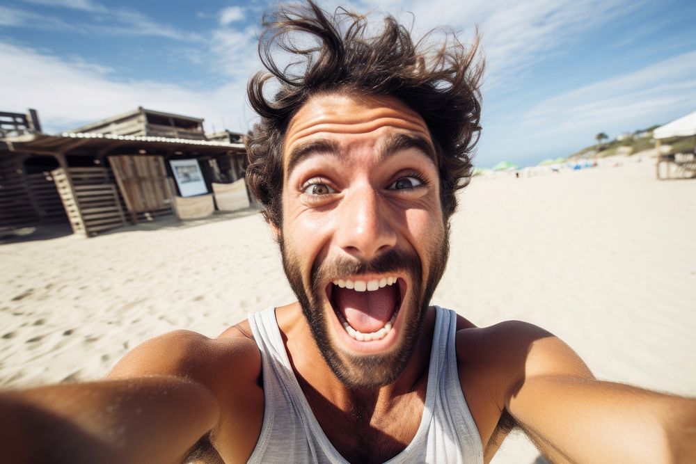 Man excited face portrait selfie laughing.