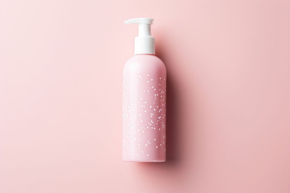 Body lotion package on pink water pattern cosmetics bottle container.