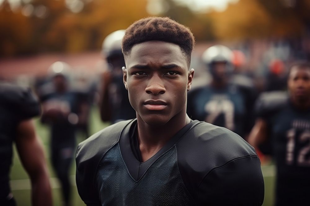 Black teen enjoy playing american football on field portrait sports adult.