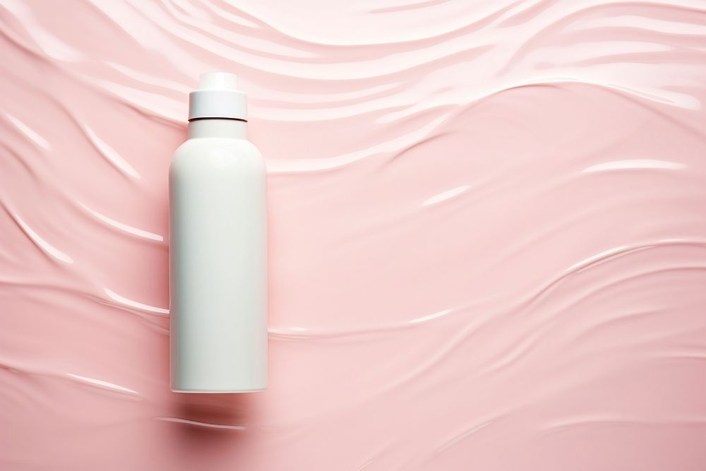 Cream bottle on pink water pattern backgrounds cosmetics container.