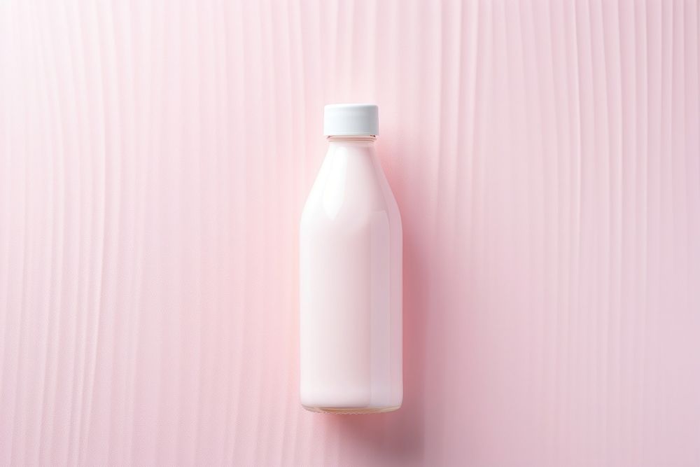 Cream bottle on pink water pattern milk refreshment container.