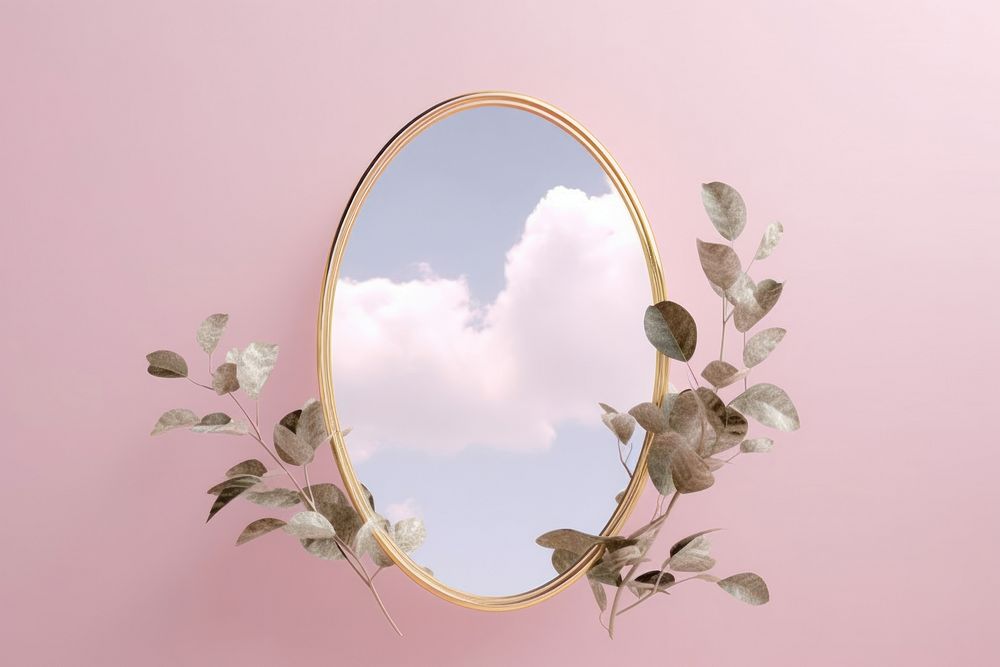 Leaves with golden oval frame mirror cloud plant photo.
