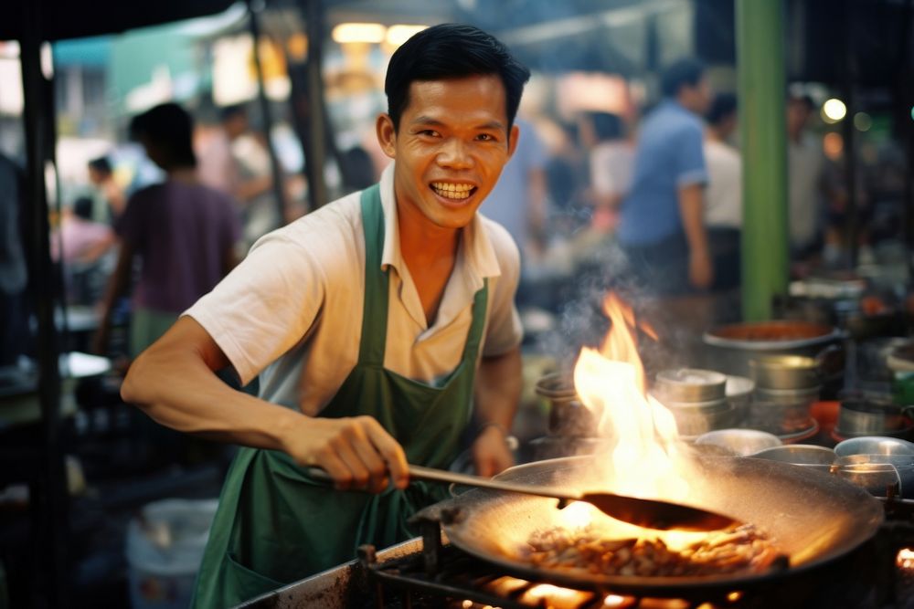 Thai chef cooking food street.