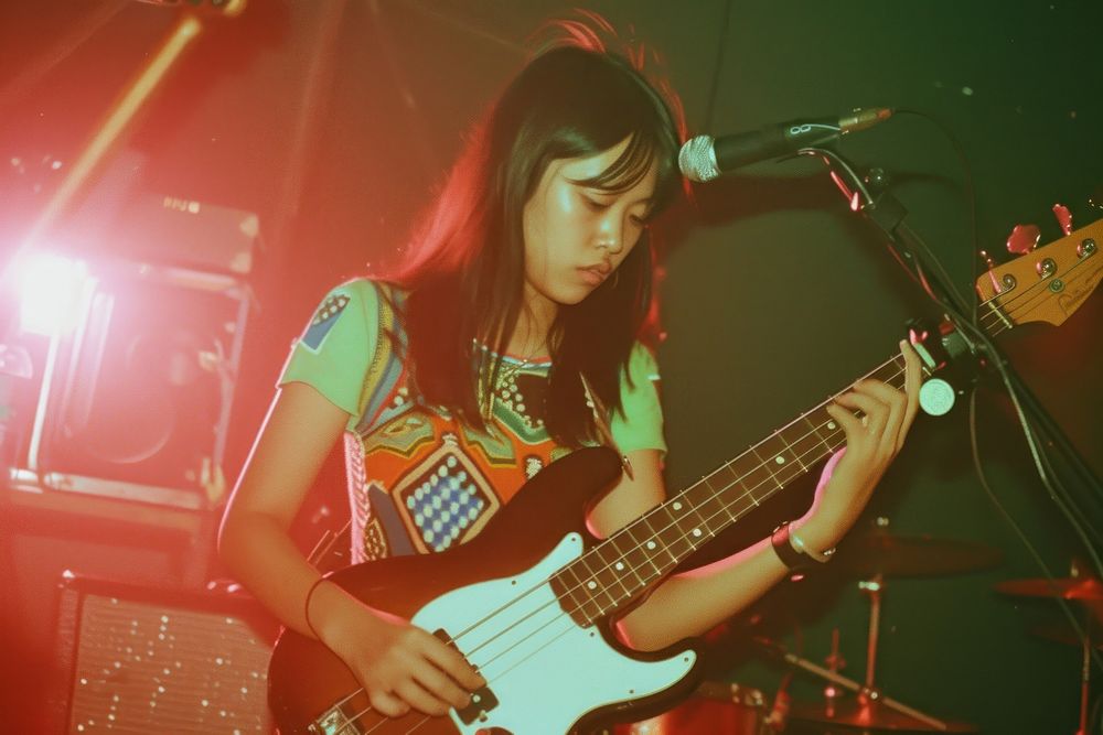 Thai girl guitar music microphone.