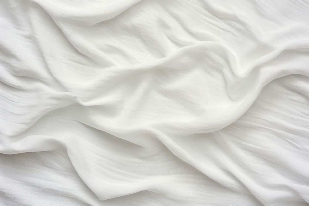 White fabric texture backgrounds silk crumpled.