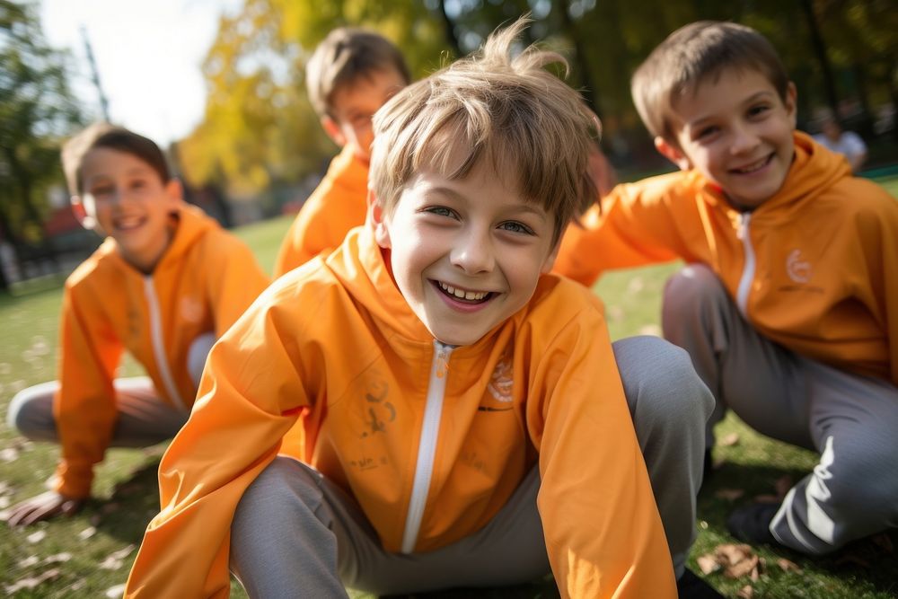 Boys stretching before exercise portrait outdoors child.