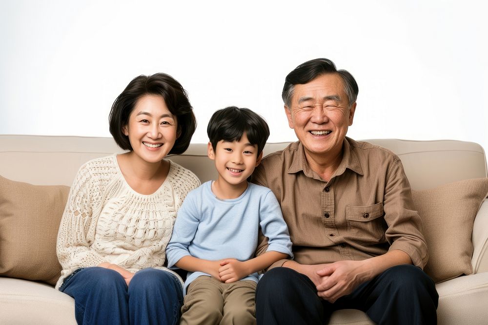 Korean family sitting furniture smiling parent.