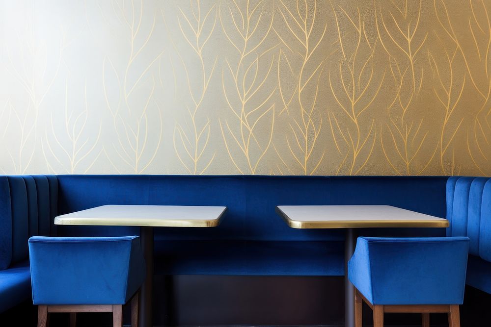 Blue and gold wallpaper restaurant architecture furniture.