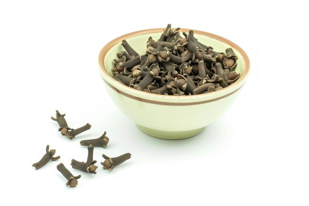 Cloves in bowl spice food white background.