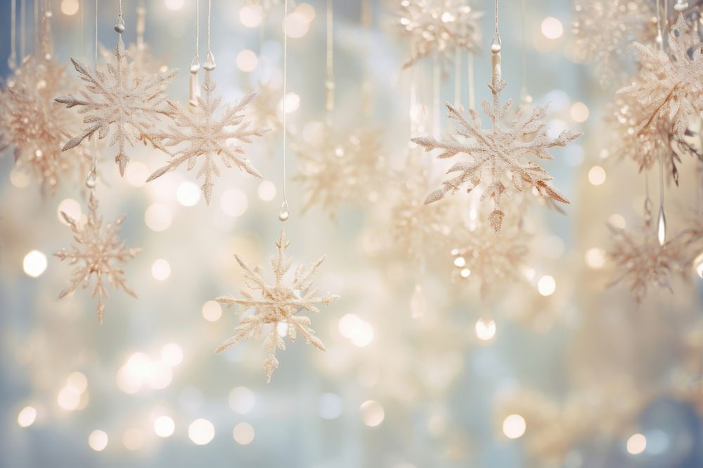 Elegant snowflakes suspended from a luminous bright light background backgrounds christmas illuminated.