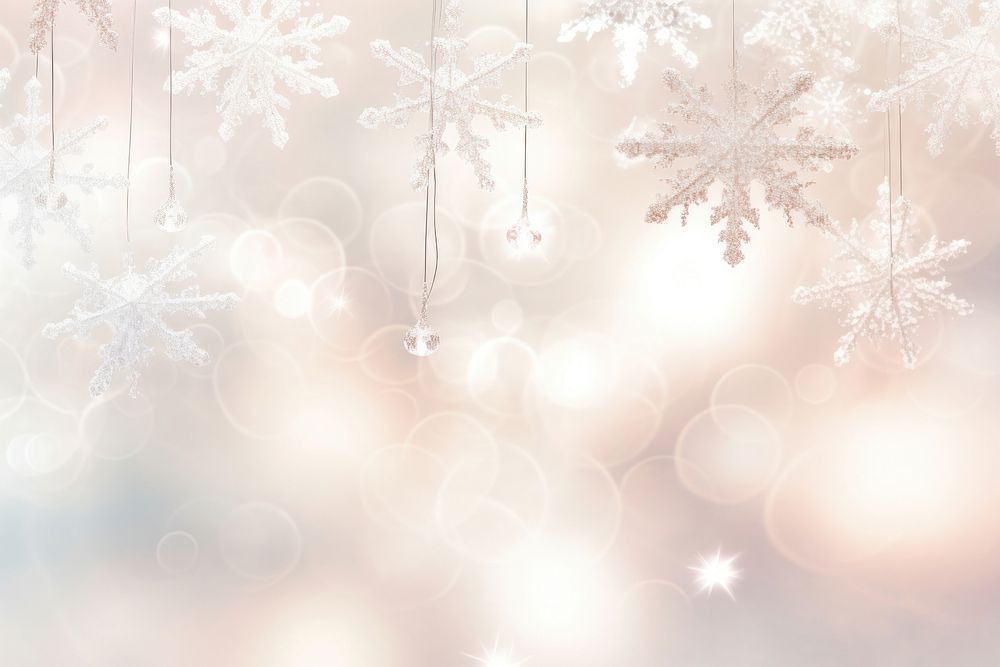 Elegant snowflakes suspended from a luminous bright light background backgrounds illuminated celebration.