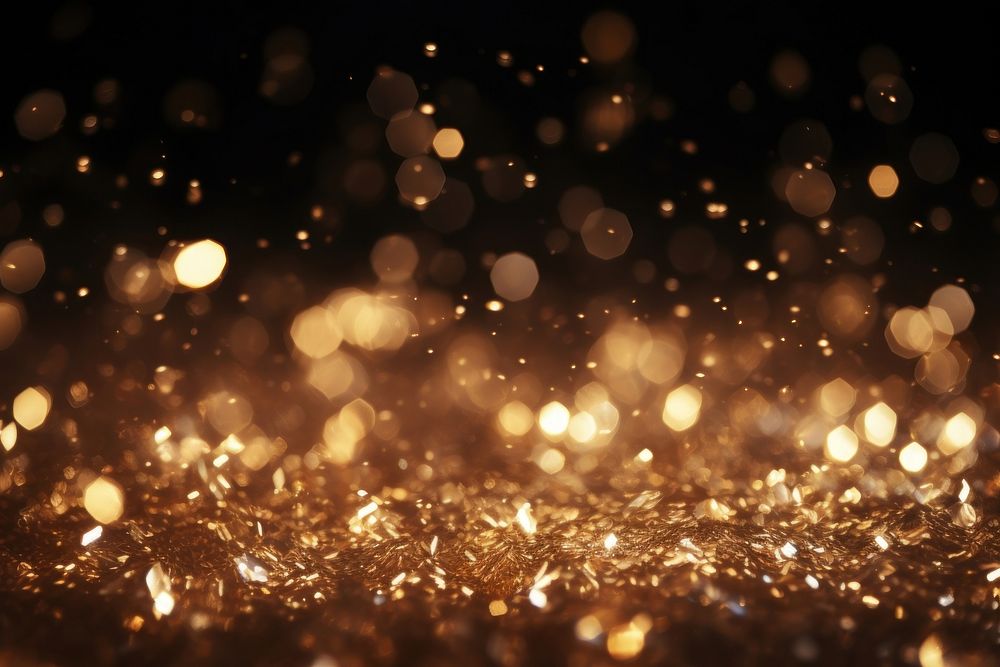 Golden dust light backgrounds christmas lighting.