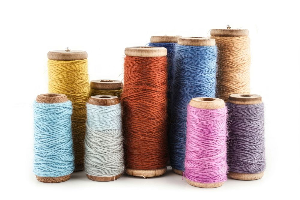 Silk yarn bobbins linen wool white background.