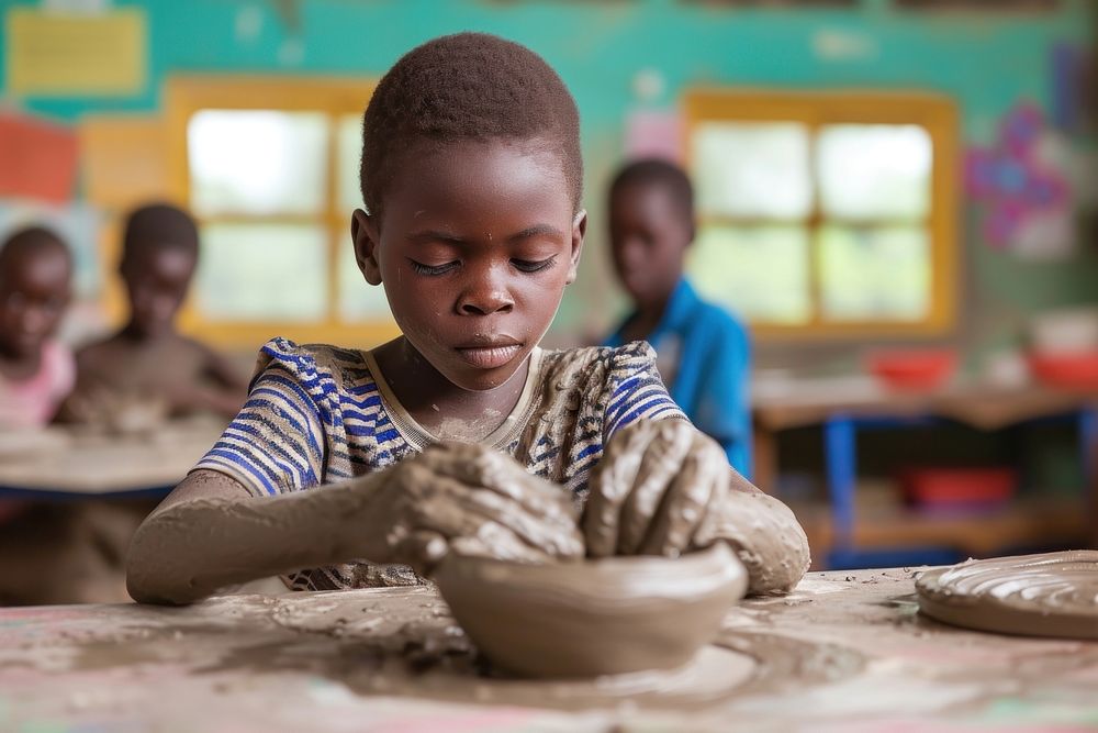 Sculpts clay crafts pottery classroom child kid.