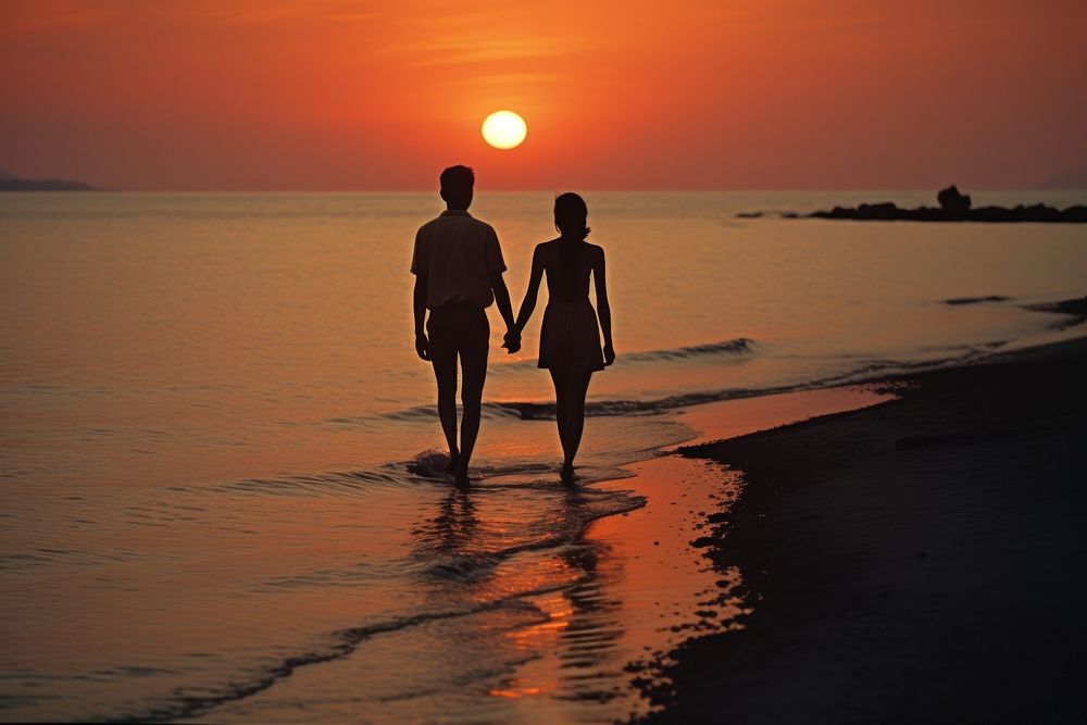 Thai man and woman outdoors walking sunset.