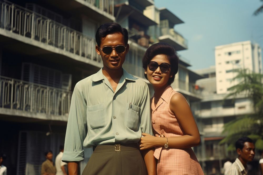 Thai man and girl architecture sunglasses portrait.