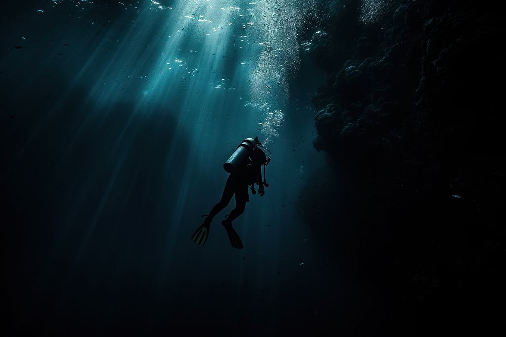 Diver exploring the underwater with deep-sea creatures recreation adventure swimming.