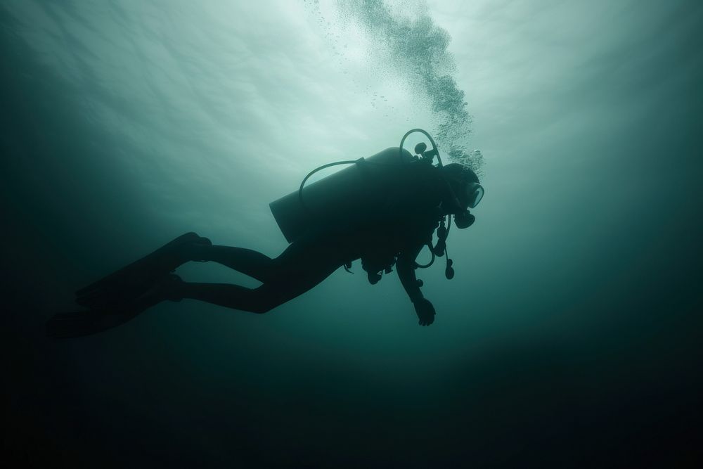 Diver in the deep dark Underwater Sea recreation underwater adventure.