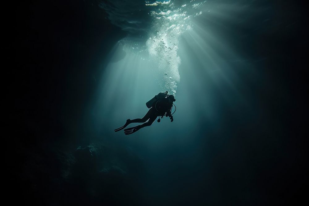 Diver in the deep dark Underwater Sea underwater adventure swimming.
