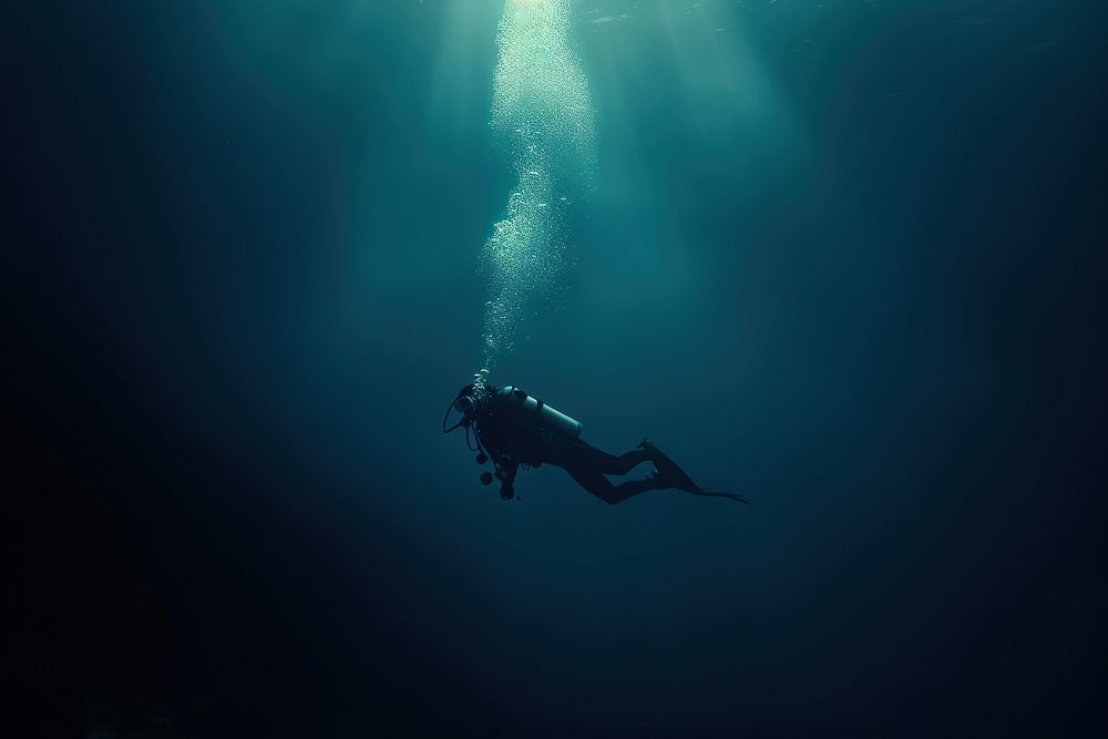 Diver in the deep dark Underwater Sea underwater recreation adventure.