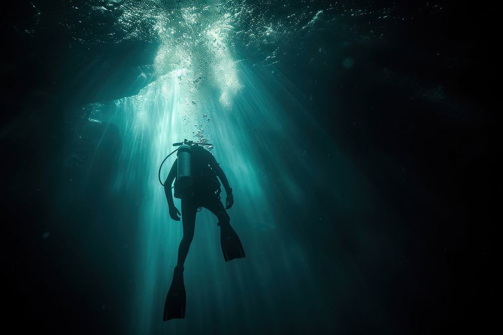 Diver in the deep dark Underwater Sea underwater recreation adventure.