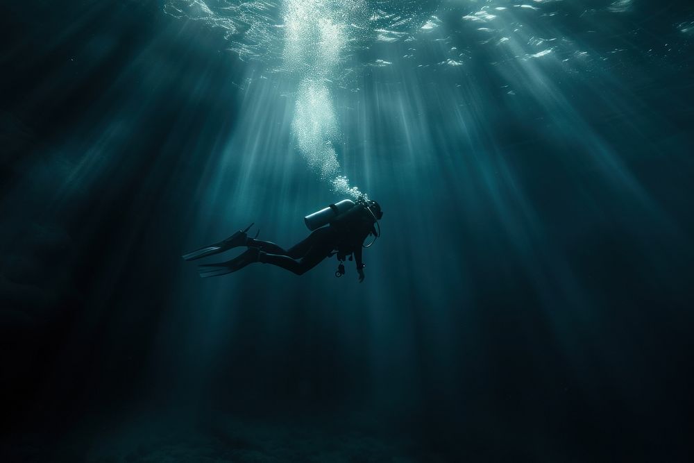Diver in the deep dark Underwater Sea underwater adventure swimming.