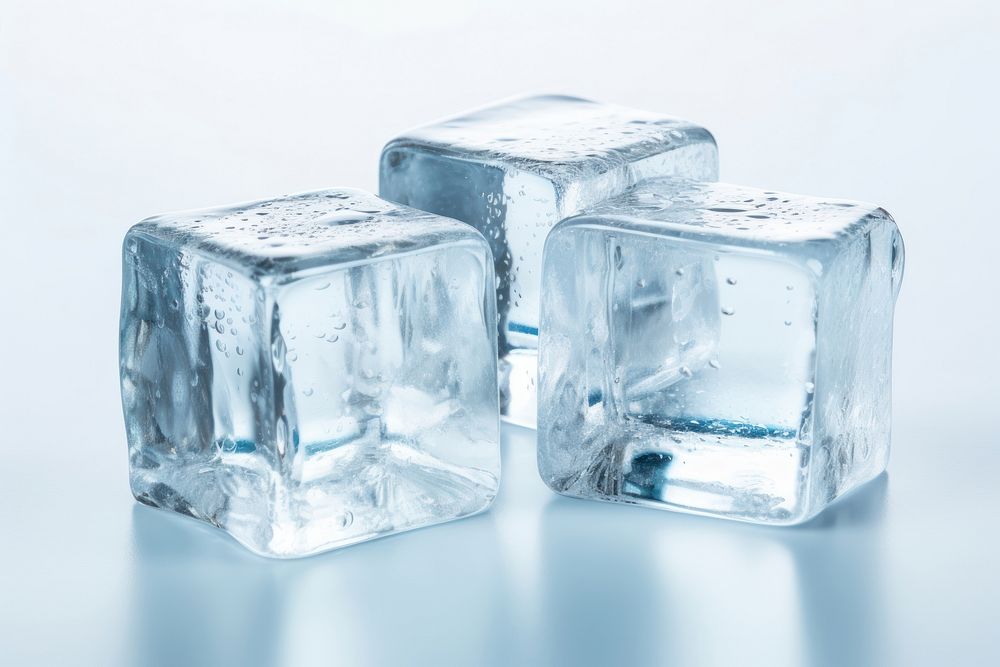 Three ice cubes white cosmetics freezing.
