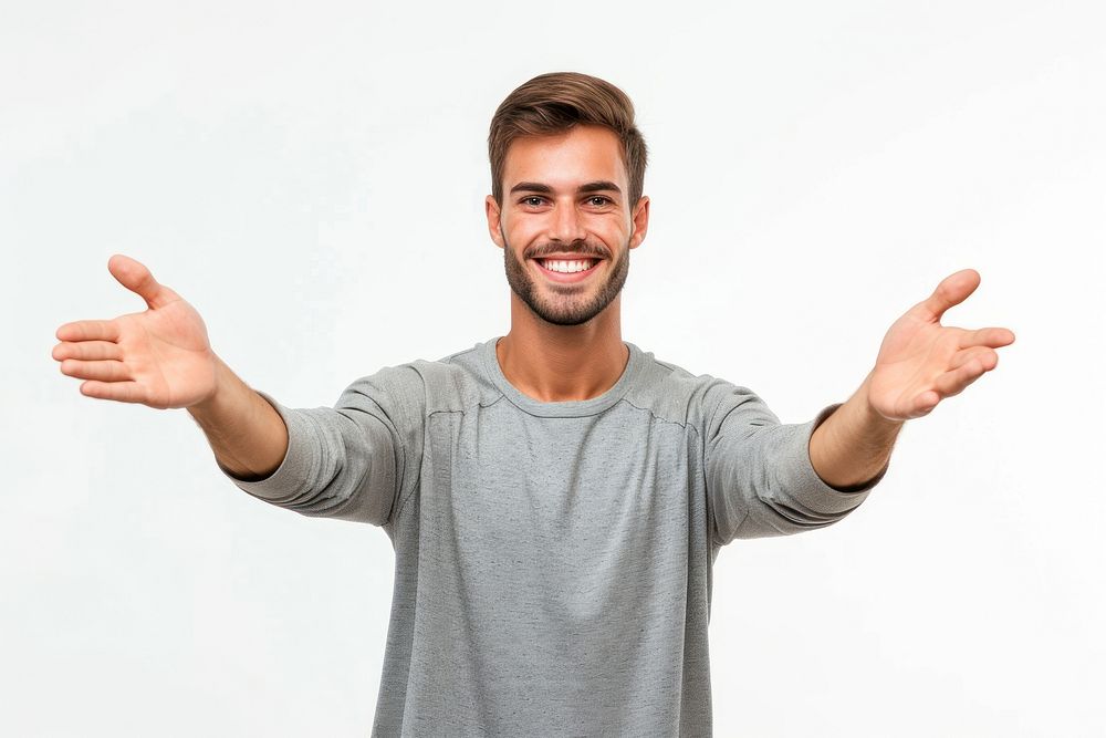 Young handsome caucasian man over isolated background extending hands to the side for inviting to come t-shirt smile adult.