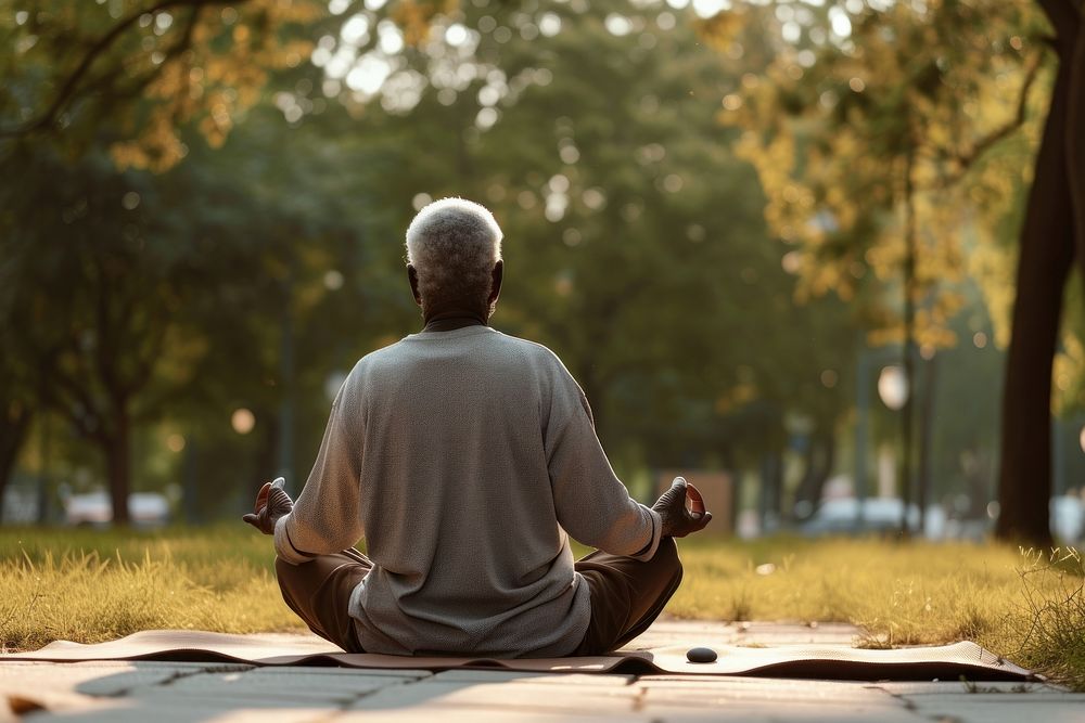 Elderly black man praticing yoga sitting sports adult.
