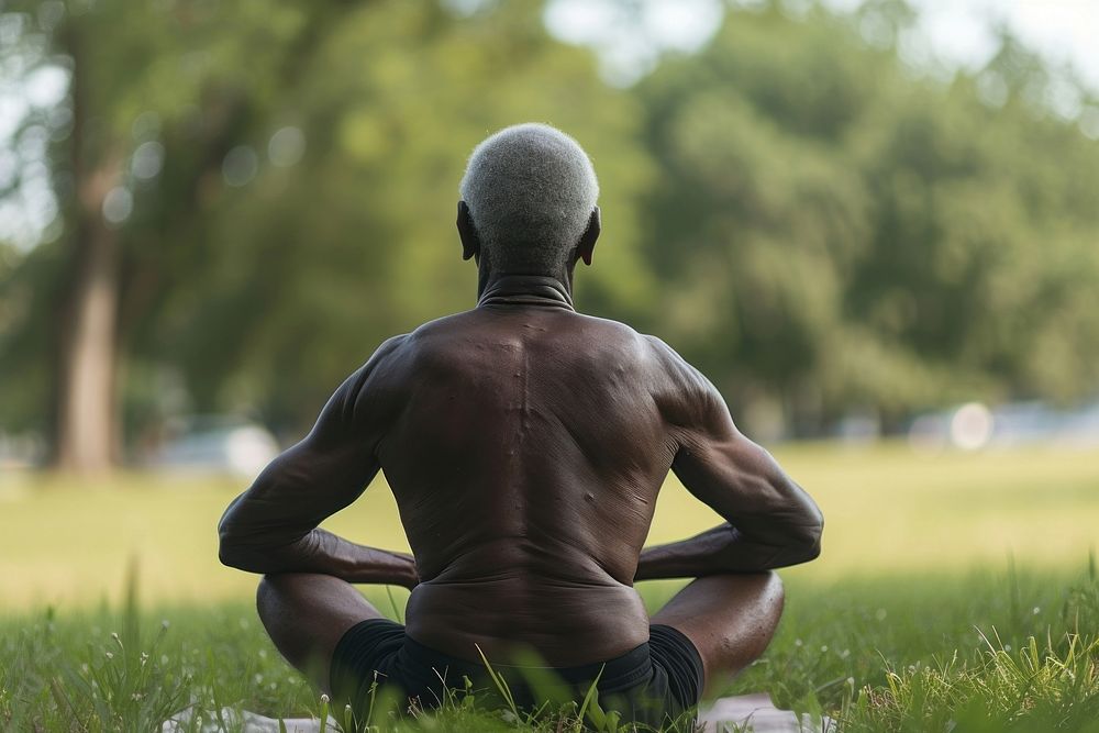 Elderly black man praticing yoga sitting adult back.