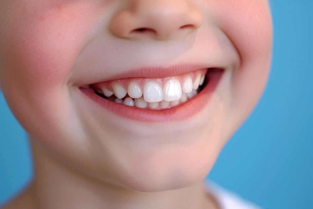 6 year old boy showing beautiful white smile teeth skin baby.