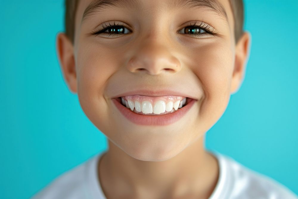 6 year old boy showing beautiful white smile teeth skin baby.