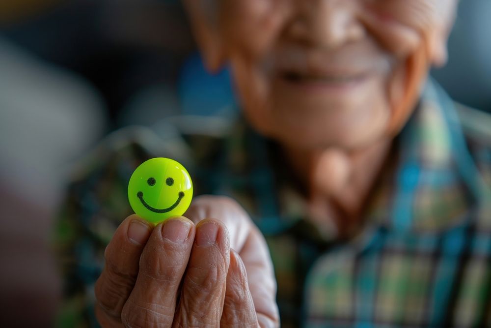 Elderly man hand holding positive green emoji portrait finger photo.