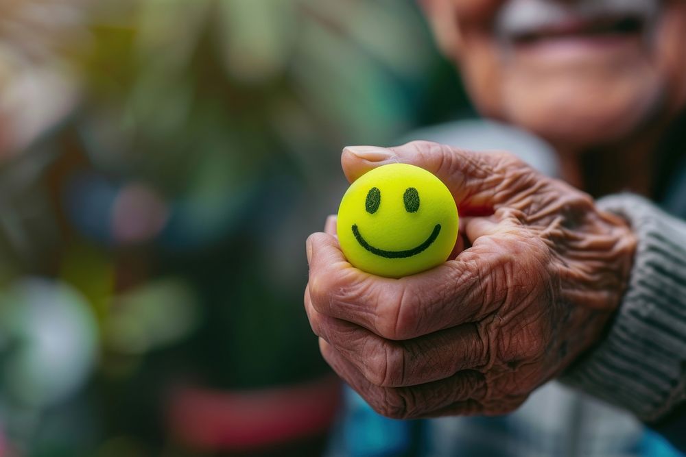 Elderly man hand holding positive green emoji happiness portrait emoticon.