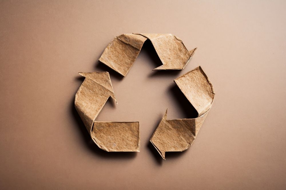 Recycling symbol made of cardboard paper recycling symbol circle shape.