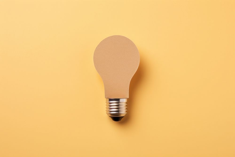 2D lightbulb symbol made of cardboard paper electricity innovation filament.