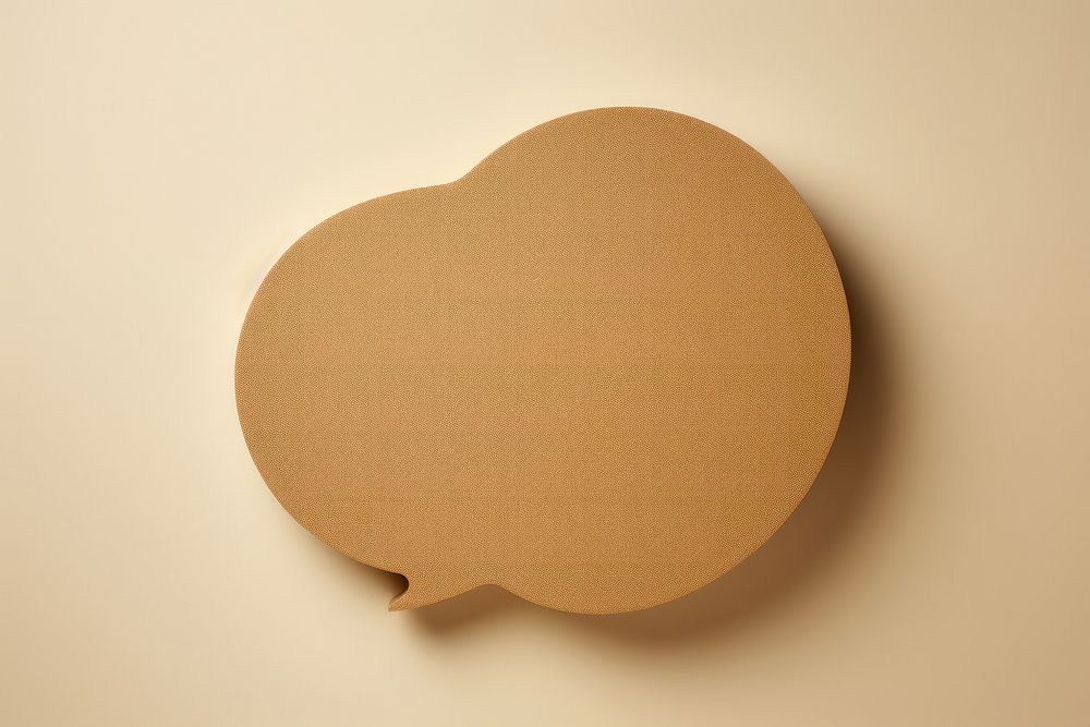 2d speech bubble symbol made of cardboard paper simplicity textured pattern.