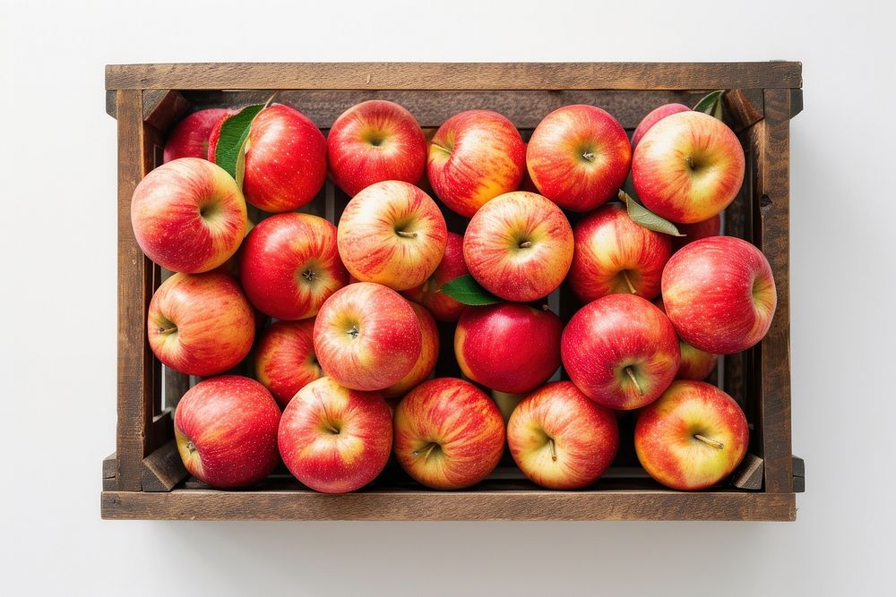 Flat lay apples fruit crate plant.