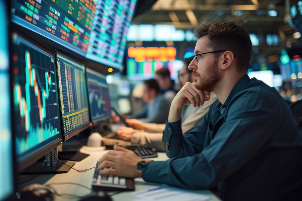 Photo of Stock market traders working in a financial office computer trading adult.