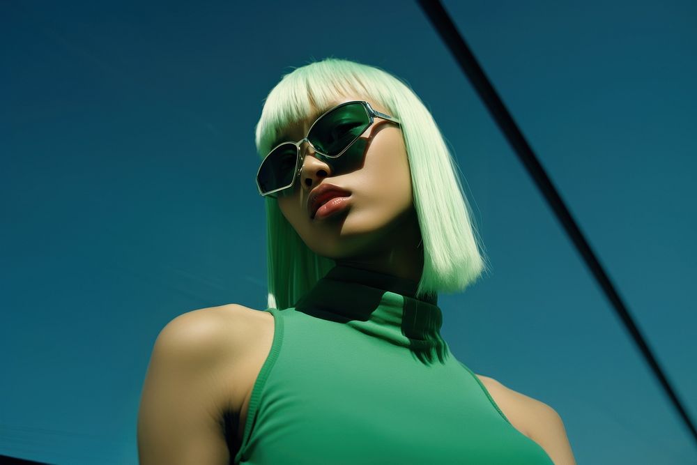 Dark skin Asian woman wear fashionable green sunglasses adult hair accessories.