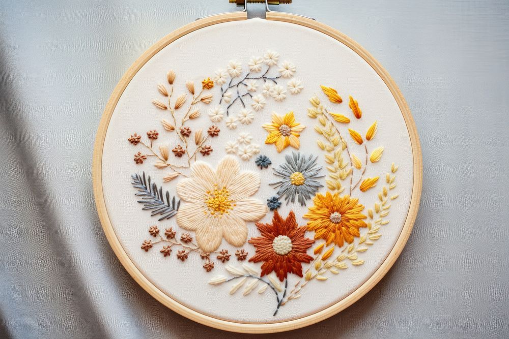 Embroidery hoop with flower in embroidery style pattern creativity needlework.