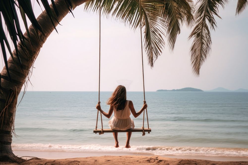 Woman at beach vacation outdoors swing.