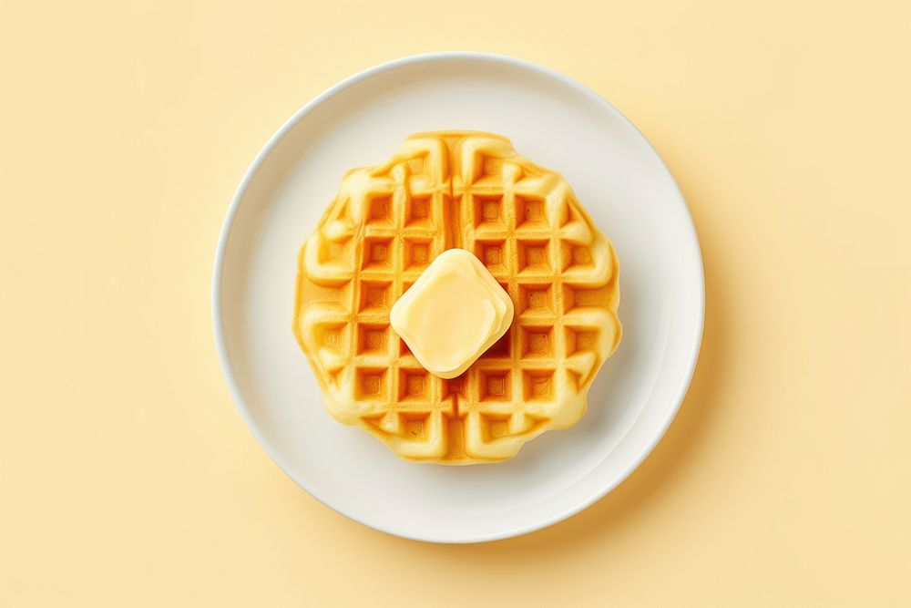 Butter waffle on a white plate yellow food breakfast.