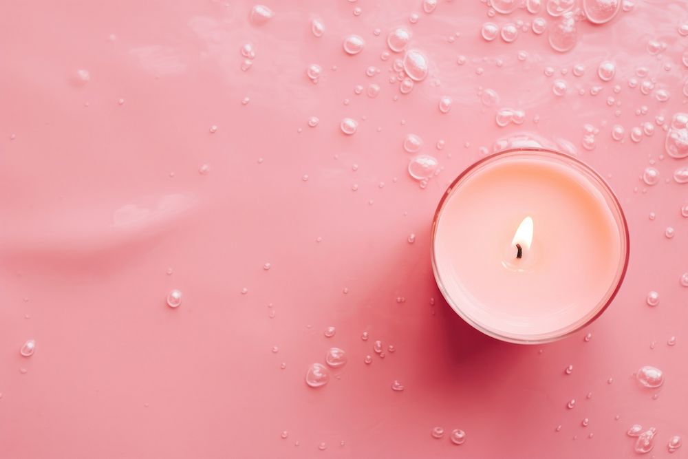 Candle on pink water pattern backgrounds lighting burning.
