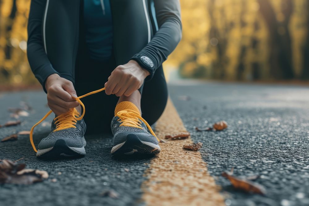 Runner woman tie shoelaces footwear road exercising.