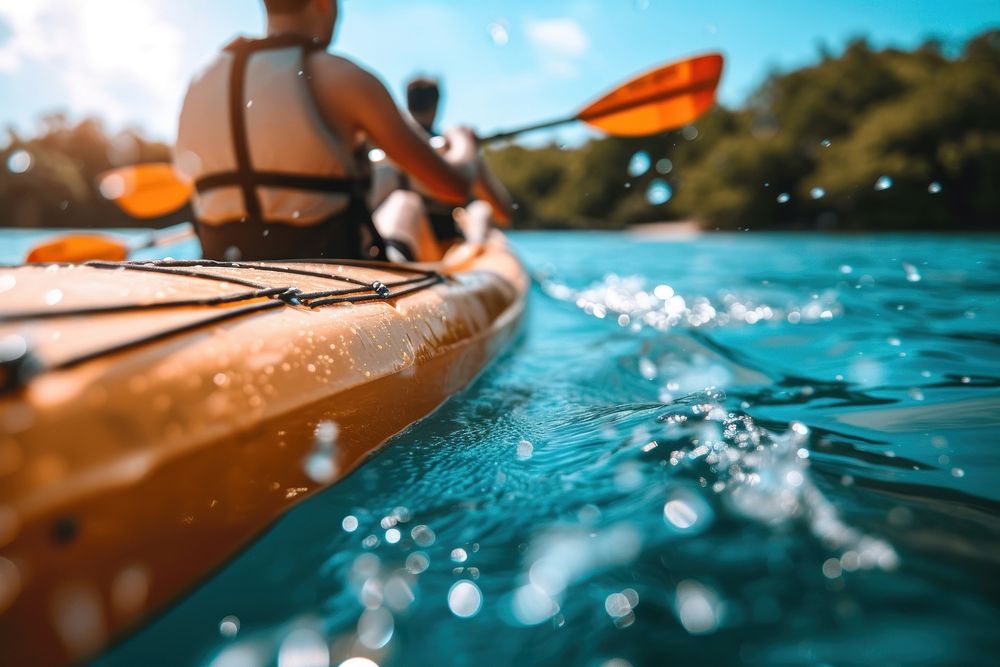 Two men paddle a kayak on the sea kayaking recreation outdoors.