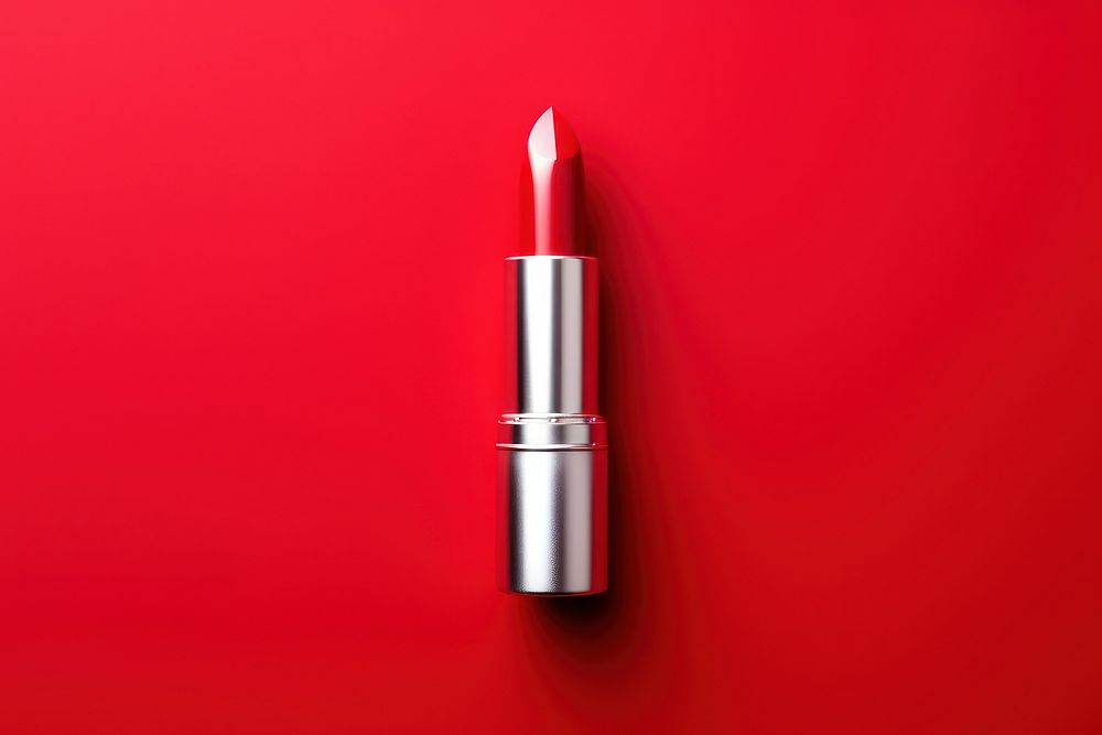 Lipstick cosmetics red red background.