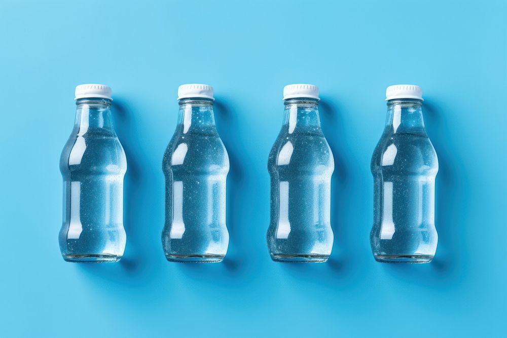 Soda bottle with white label blue blue background transparent.